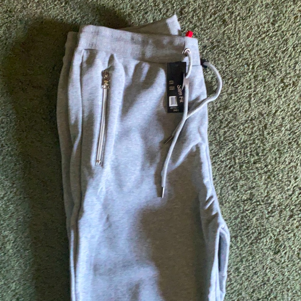 Brand new joggers with zippers
